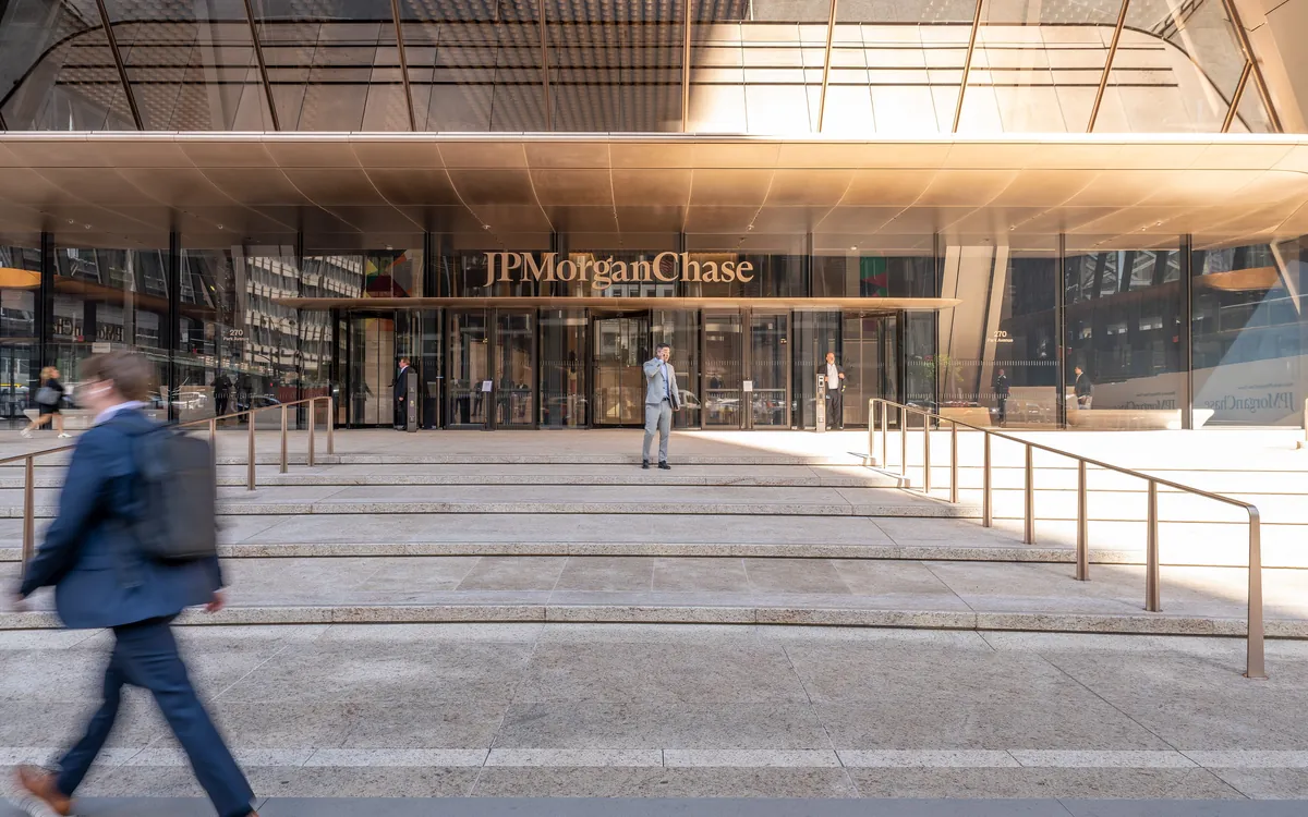 A man walks past the entrance of JPMorgan Chase's headquarters at 270 Park Avenue in New York