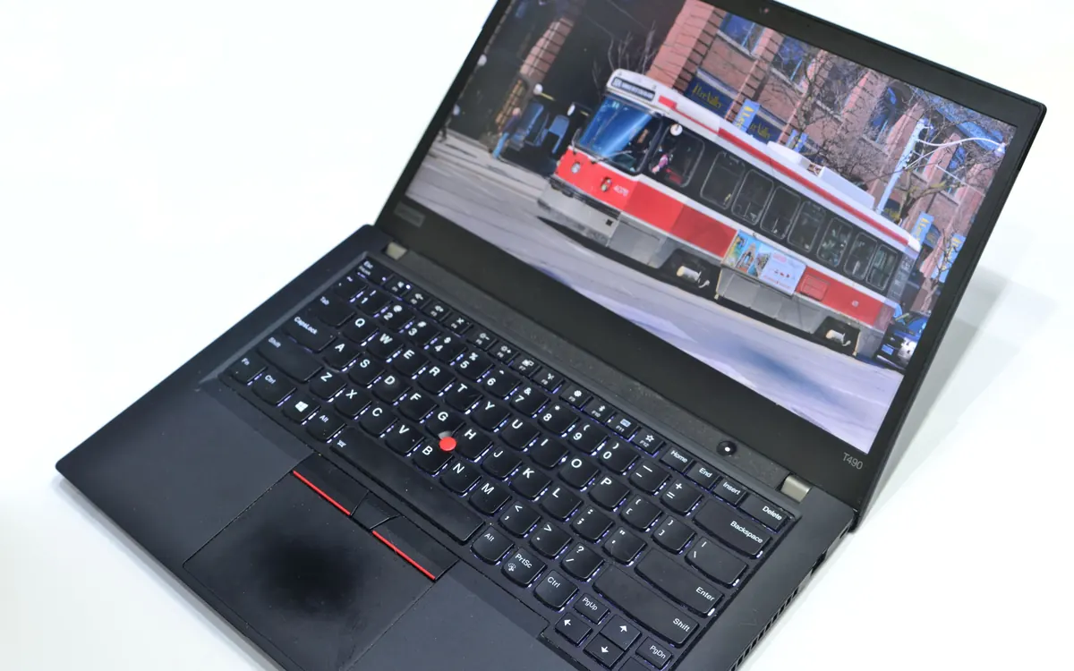 Open Lenovo ThinkPad T490 laptop showing a photo of a Toronto streetcar (illustrative photo)