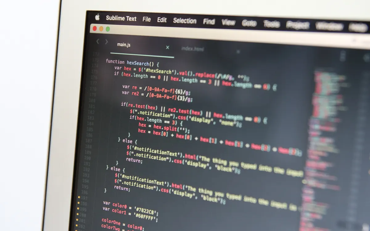 Close-up of a laptop screen showing JavaScript code in a code editor (illustrative photo)