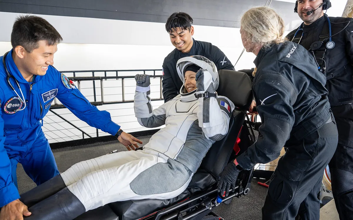 ESA astronaut Sophie Adenot assisted by recovery teams after exiting the SpaceX Dragon capsule