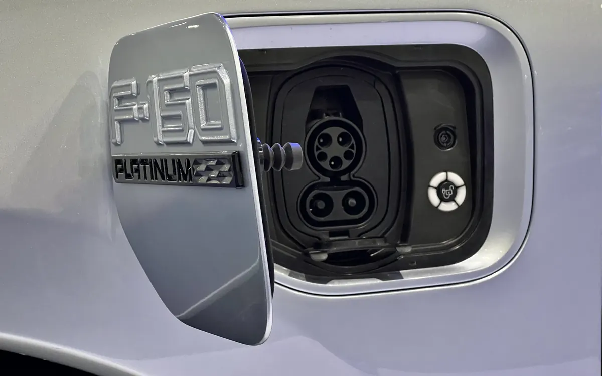 Open charging port flap on a Ford F-150 Lightning Platinum (illustrative photo; not the Fathom)
