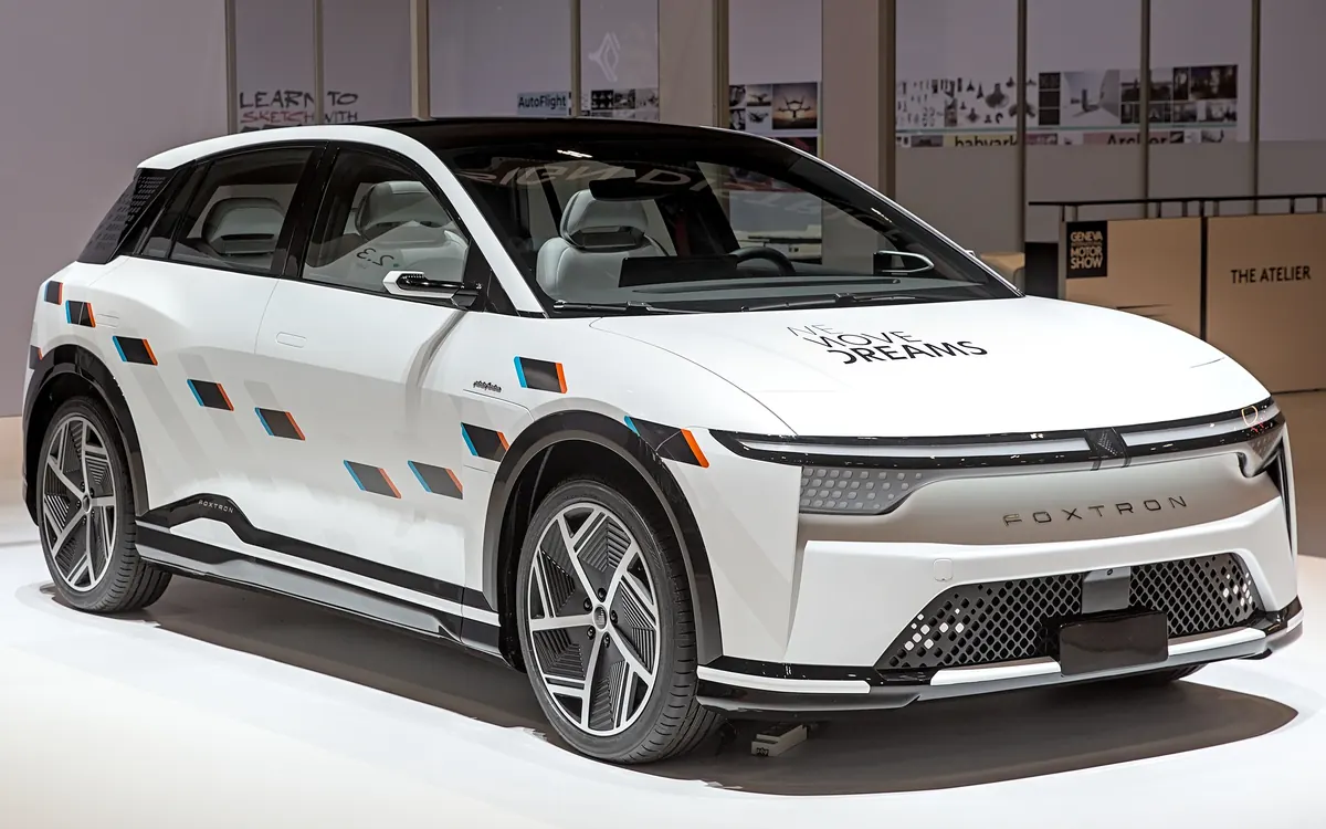 A white Foxtron Model B crossover on display at the Geneva motor show, an earlier Foxconn reference EV (illustrative photo)