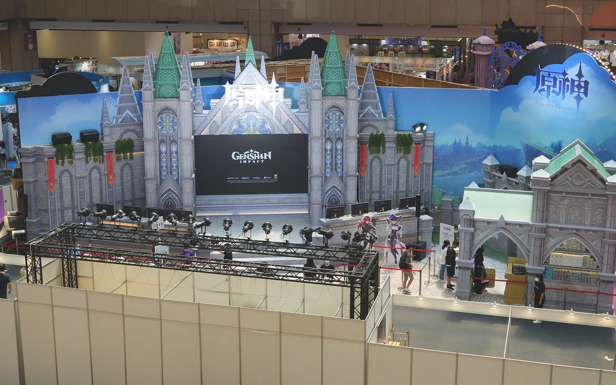 Genshin Impact stage with a castle-style set at a 2022 fan event (illustrative photo)