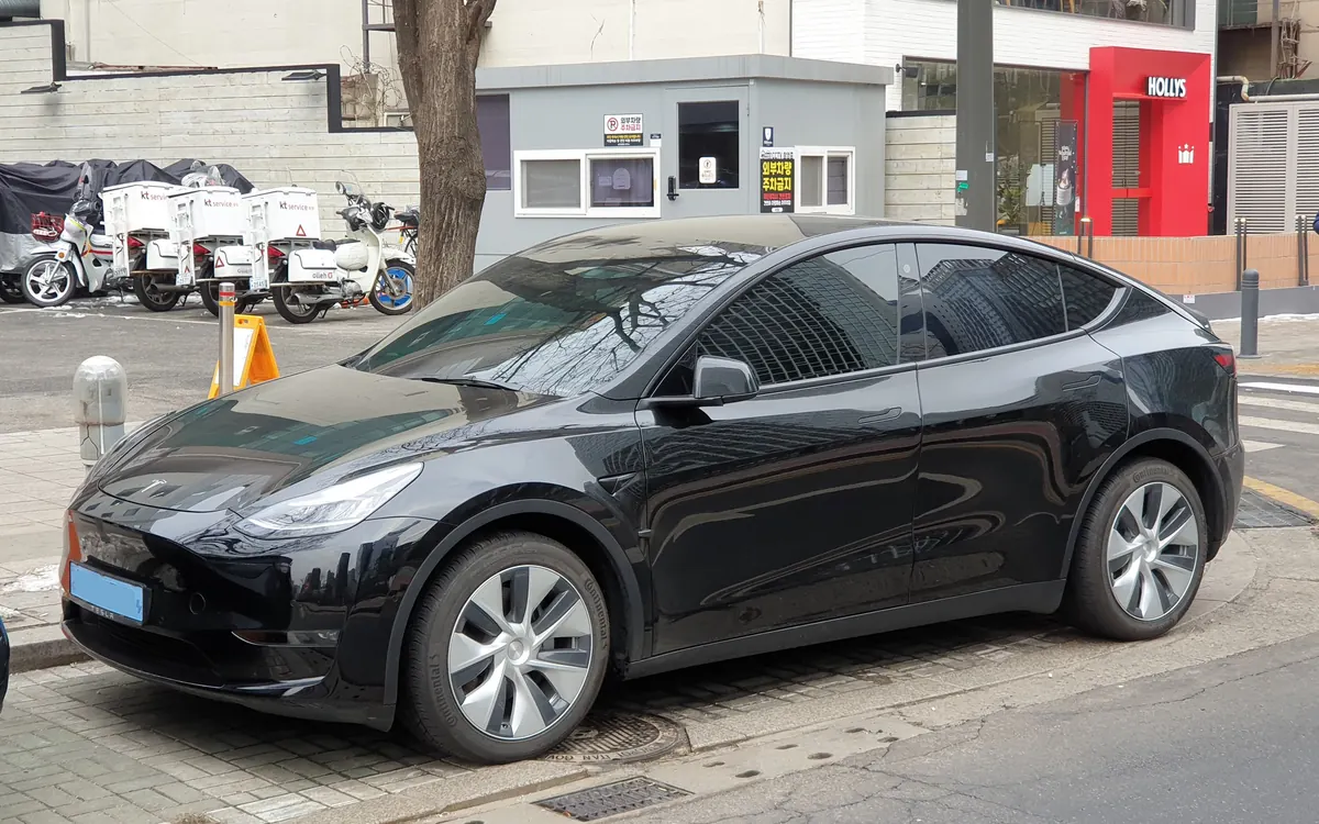 Black Tesla Model Y parked on a city street (illustrative photo)