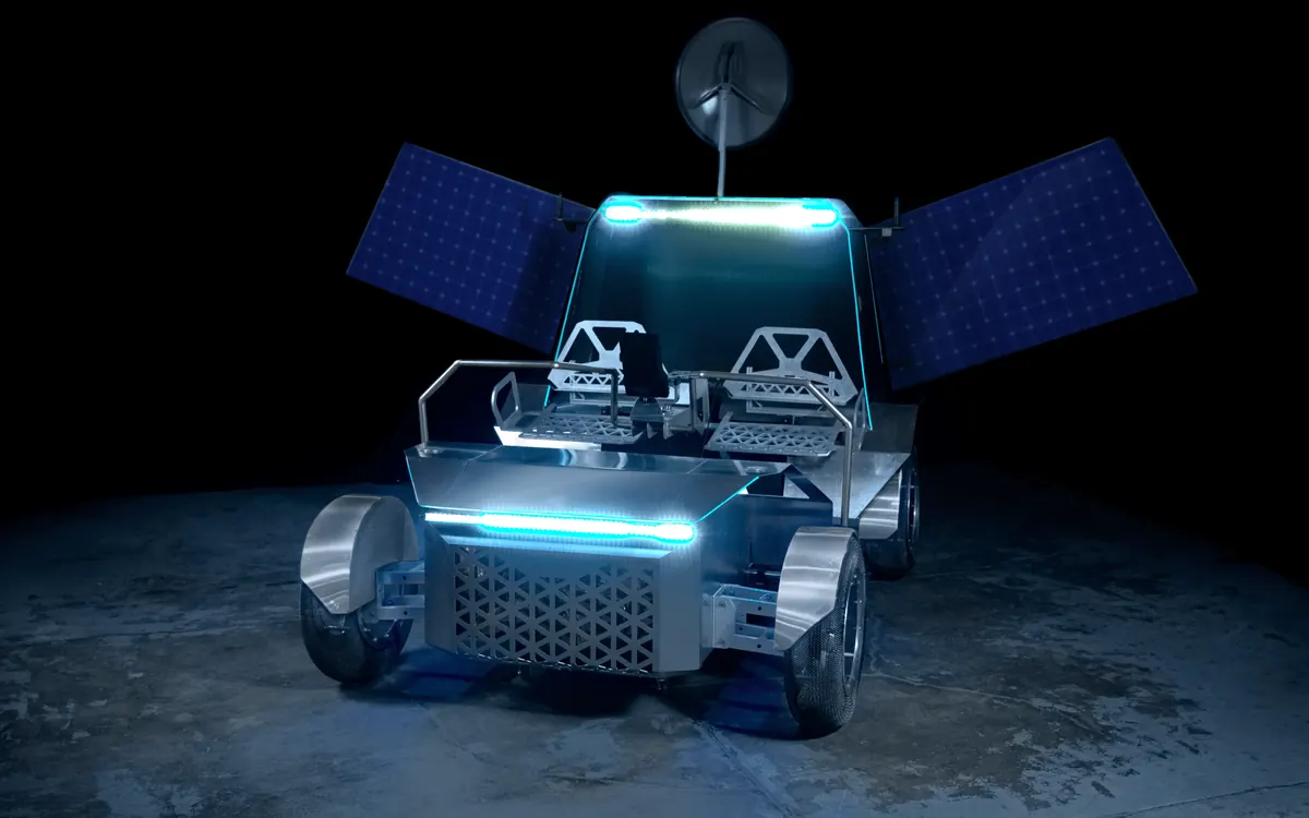 Повнорозмірний прототип місяцехода Pegasus від Lunar Outpost з піднятими сонячними панелями в темній студії