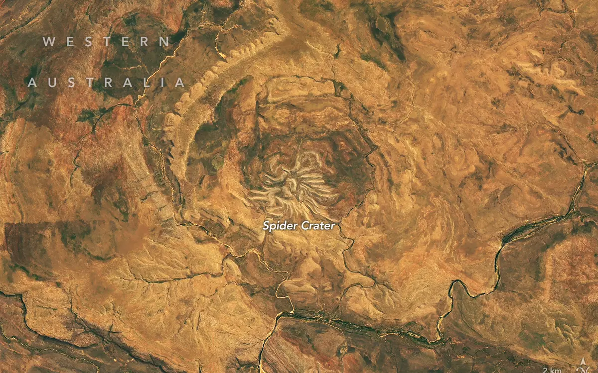 Landsat 9 satellite view of Spider Crater in Western Australia, with pale sandstone ridges radiating from its centre