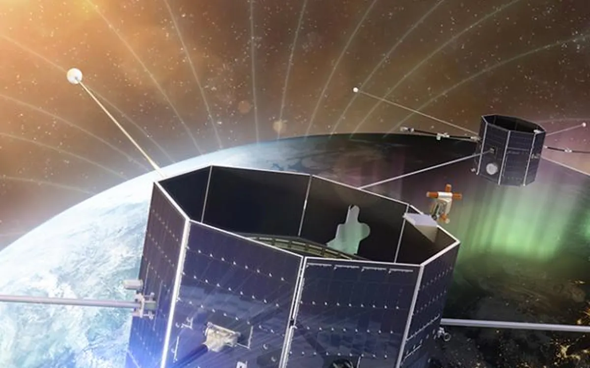 Художественное изображение спутников-близнецов NASA TRACERS на орбите над Землёй с полярным сиянием внизу