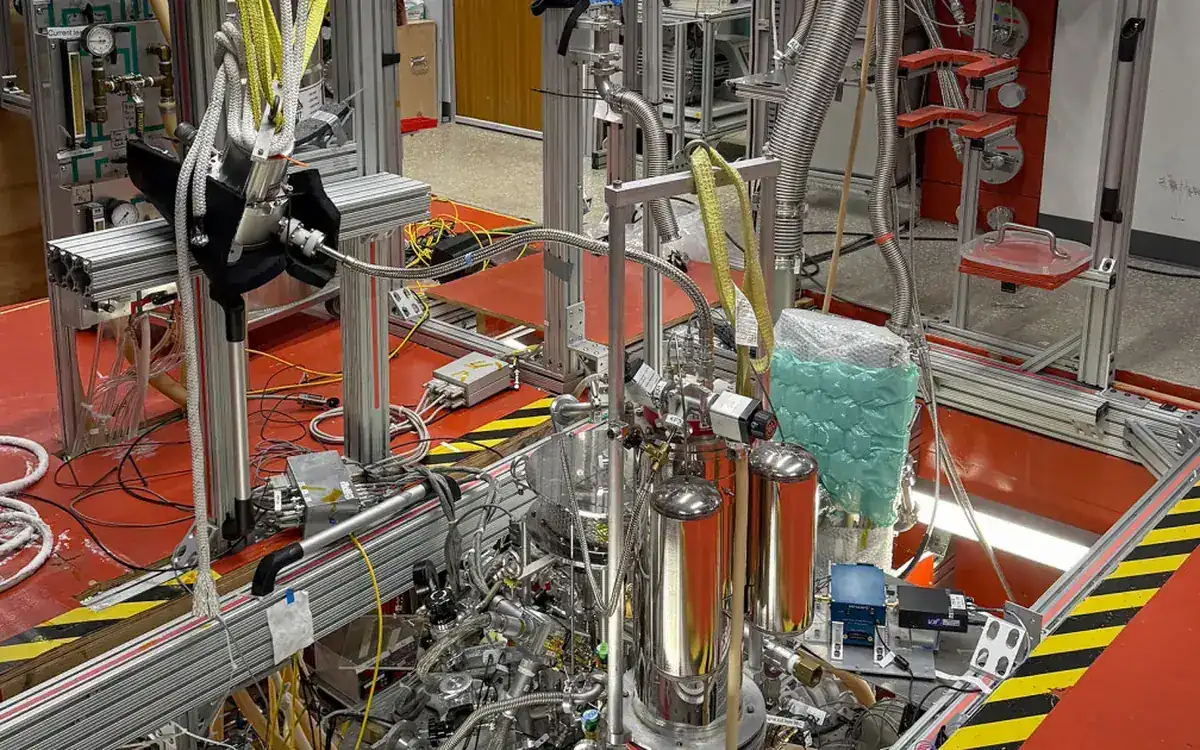 Gabrielse lab at Northwestern University, with the tank that holds the trapped positron lowered below floor level