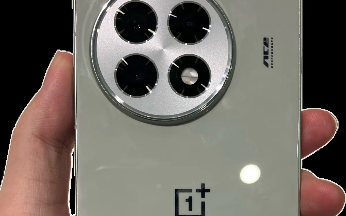 The back of an older OnePlus Ace 5 phone held in a hand, showing its round camera module (illustrative photo, not the Ace 7)