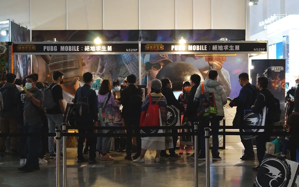 Visitors queue at a PUBG Mobile booth at a games exhibition (illustrative photo)