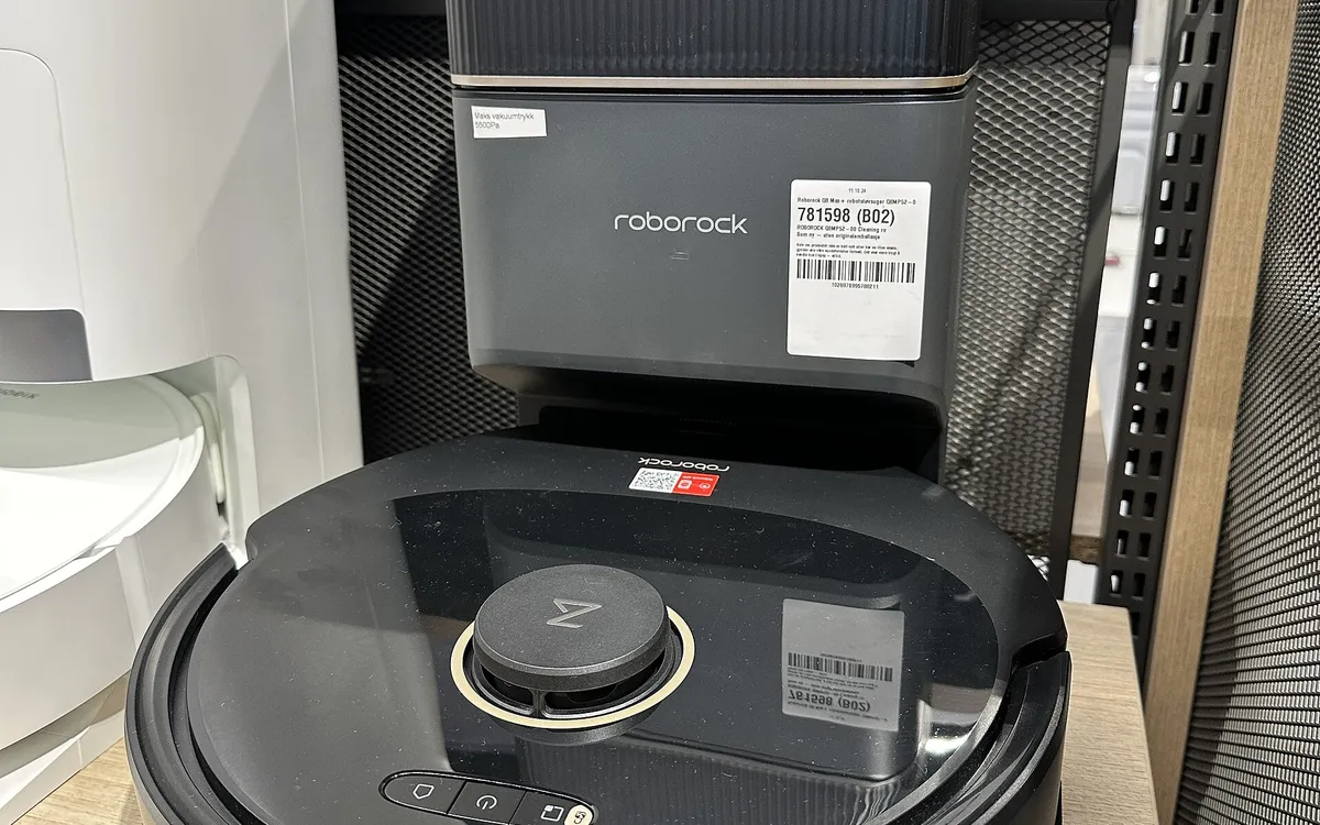 An iRobot Roomba robot vacuum cleaning a wooden floor (illustrative photo)