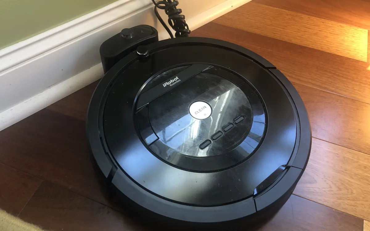 A Roomba robot vacuum on its charging base (illustrative photo)