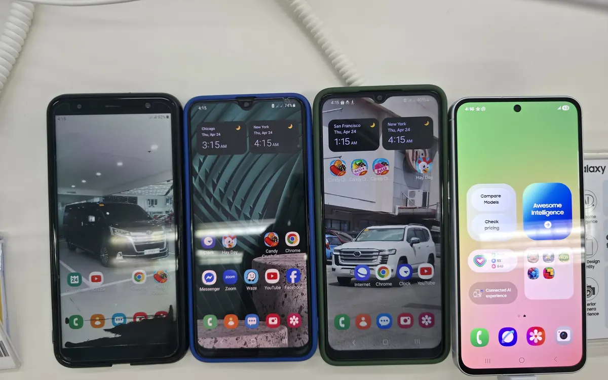 Four Samsung Galaxy phones, including the Galaxy A30s, A04s and A56 5G, standing side by side on a store display