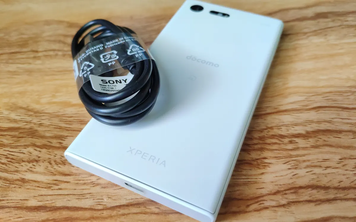 White Sony Xperia compact phone (illustrative photo of an older Xperia model)
