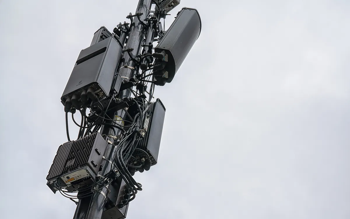 5G antennas and radio units mounted on a cell tower (illustrative photo)