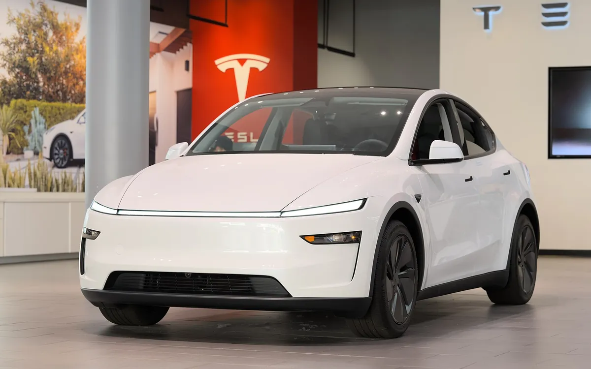 A white Tesla Model Y parked outdoors (illustrative photo)